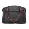 The Concealed Carry Carly Satchel by Lady Conceal features black leather, brown handles, a front zipper pocket, and two vertical zippered compartments on each side.