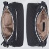 Two Hobo Concealed Carry Purses in quilted black microfiber with beige interiors and silver zippers are shown side by side, one open and one partially closed.
